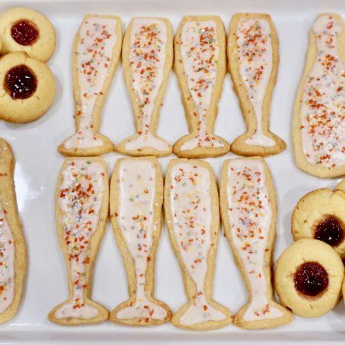 A close-up shot of champagne-infused shortbread cookies, showing their delicate texture and golden color.