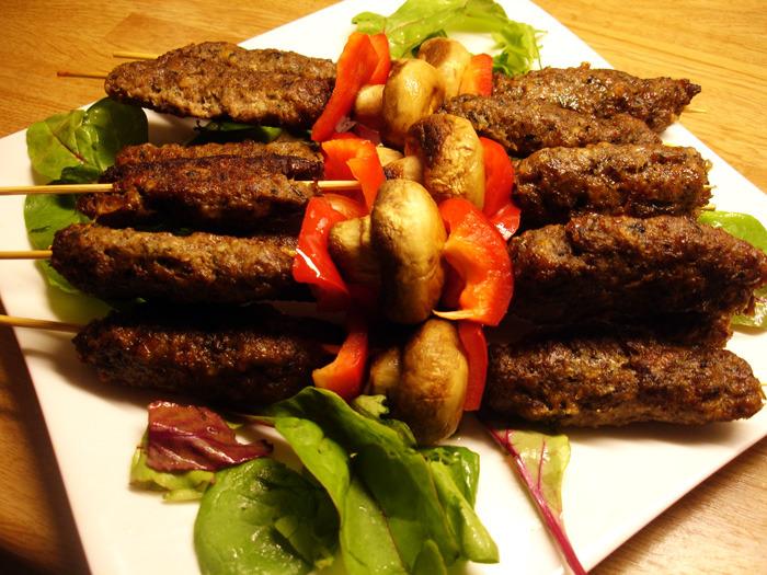 A close-up of Libyan Mbekbka Lamb Kebabs