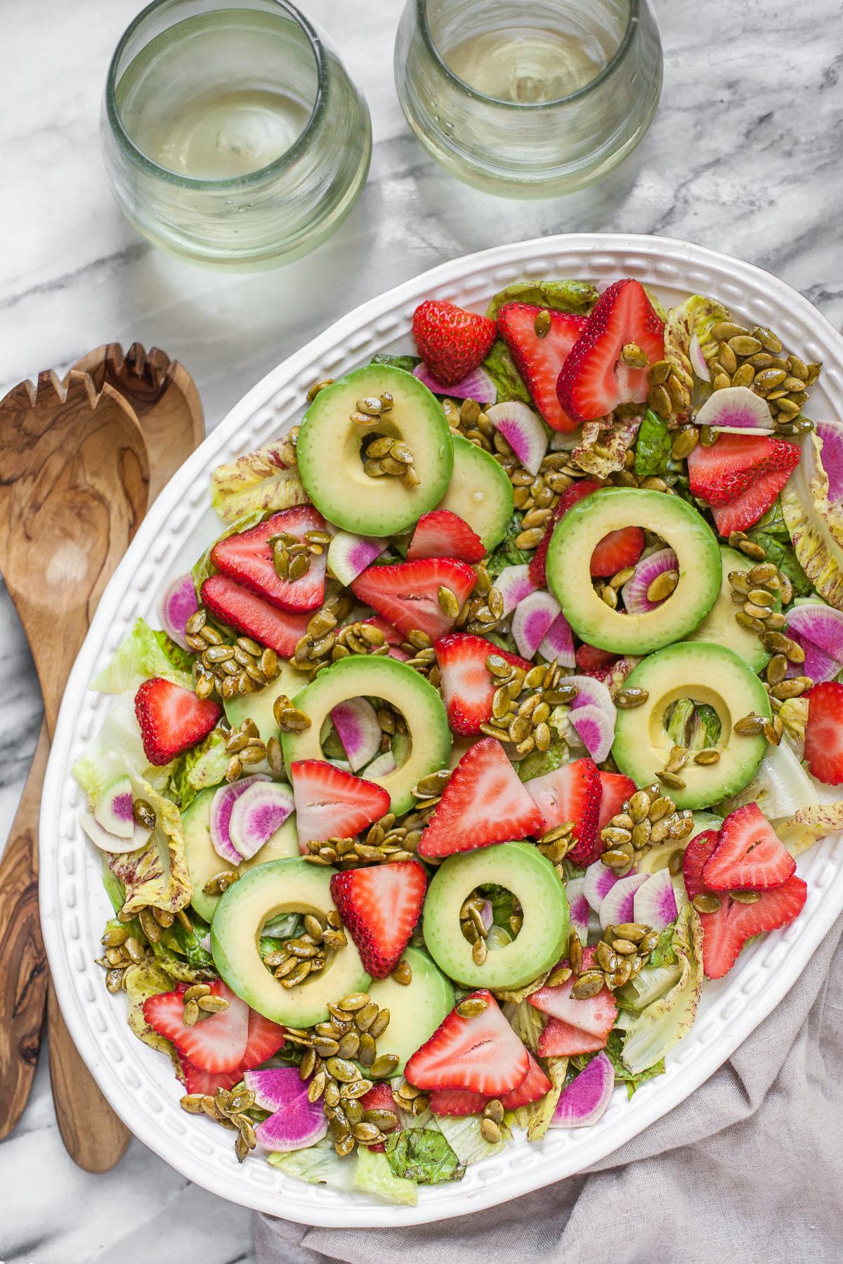 Close-up shot of a spoonful of Strawberry Enchantment Salad, showing its texture and vibrant color.
