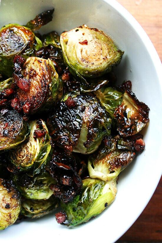 A close up shot of a single Brussels sprout, perfectly caramelized and glistening