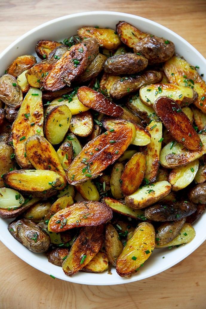 Close-up shot of roasted fingerling potatoes with herbs de Provence, looking golden brown and crispy
