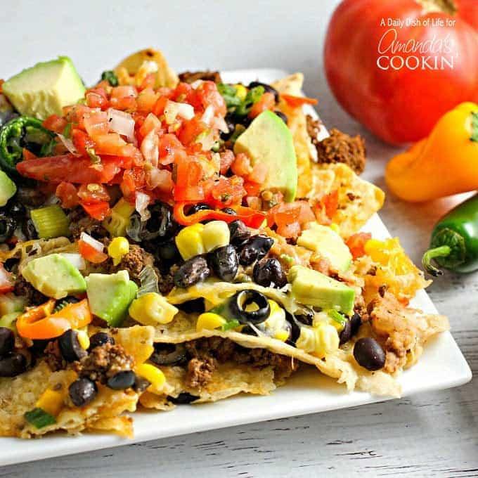 close up of a platter of festive fried green bean nachos