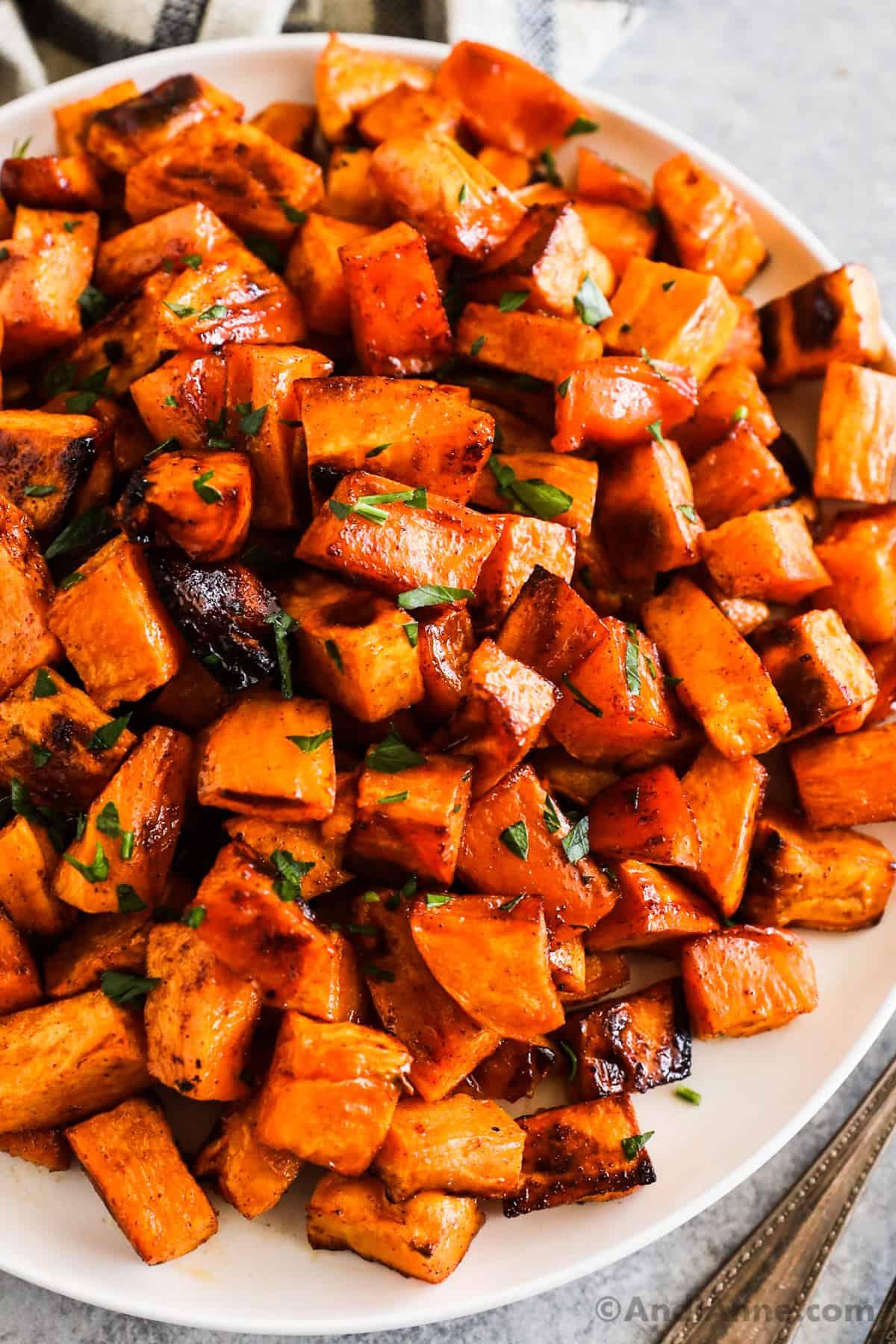 close-up of a bowl of sweet potato peels tossed with honey and cinnamon