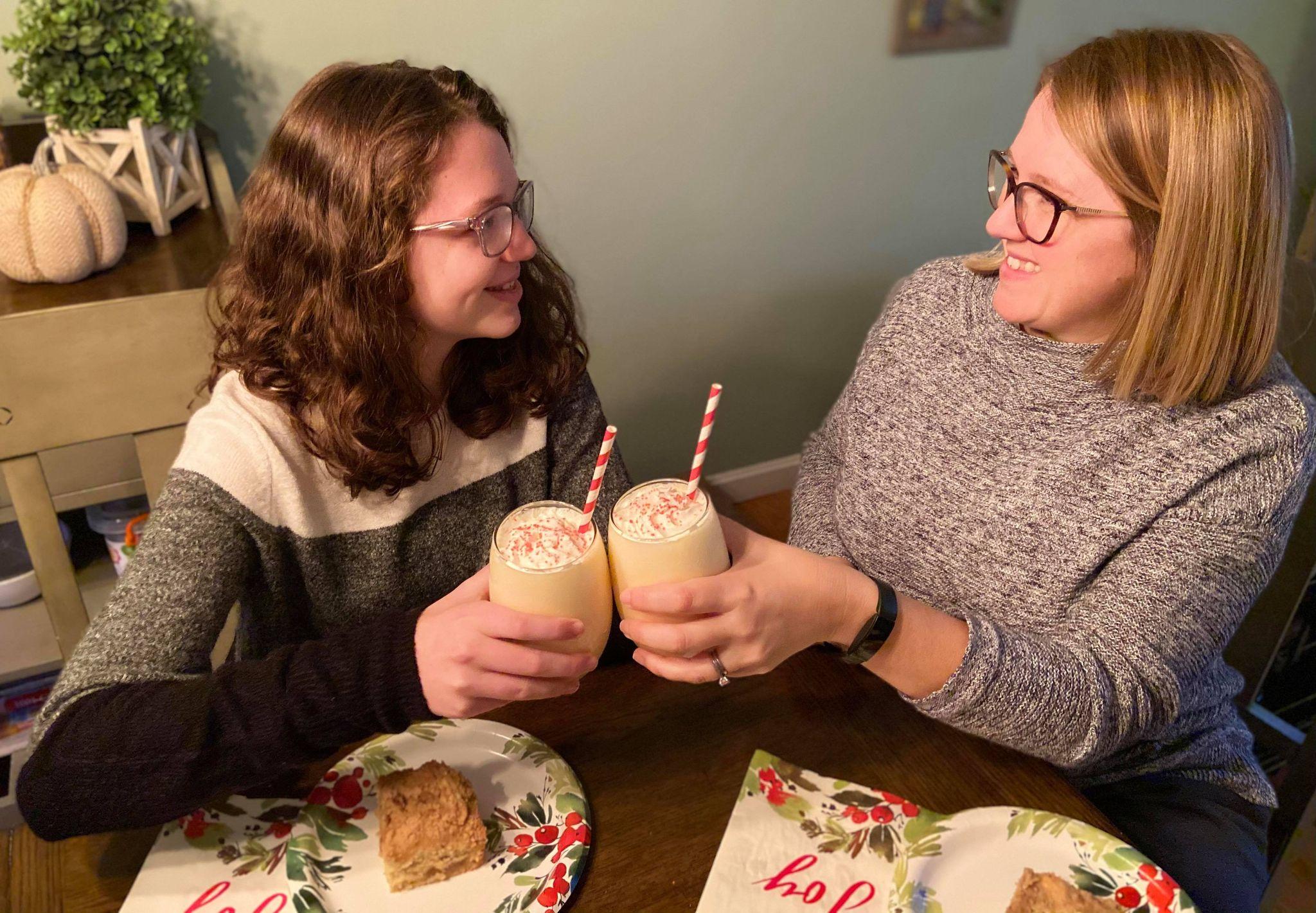 Family gathered around, enjoying eggnog smoothies