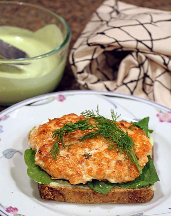 close up view of Nordic Salmon Burgers with Lingonberry Aioli on a plate