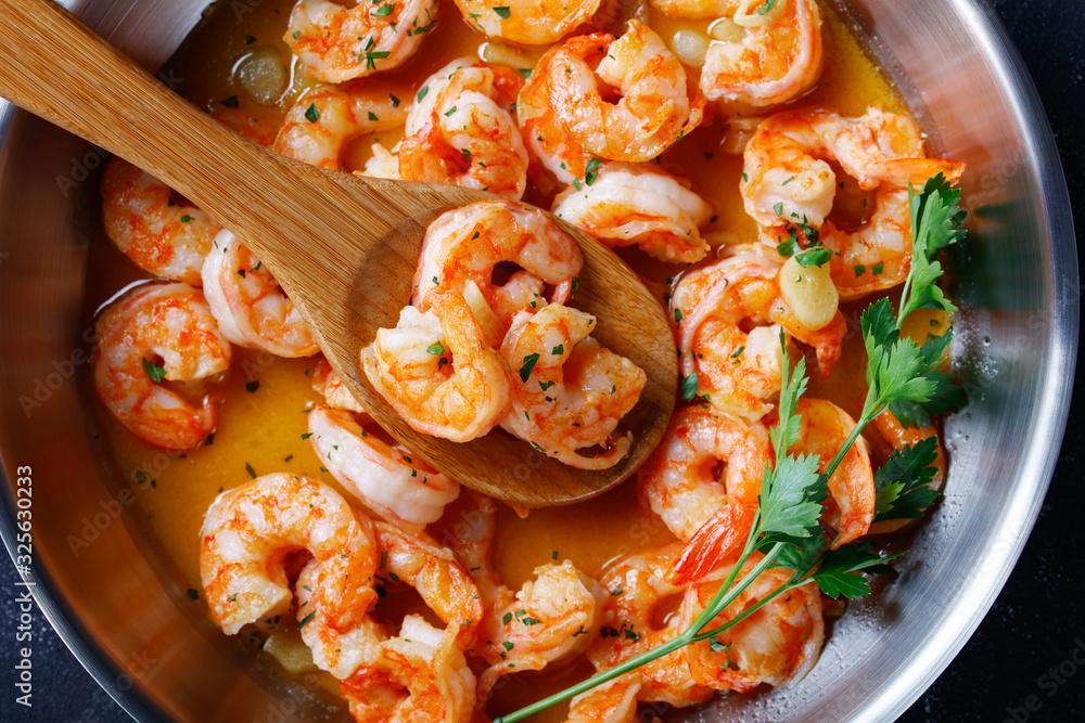 Close-up of the shrimp scampi cooking in a skillet