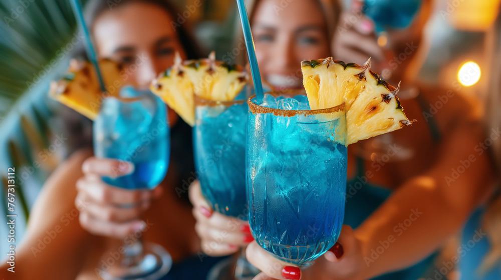 Someone enjoying the Electric Blue Lagoon cocktail at a party