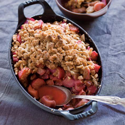 close-up shot of a single rhubarb ginger crumble bar with a fork