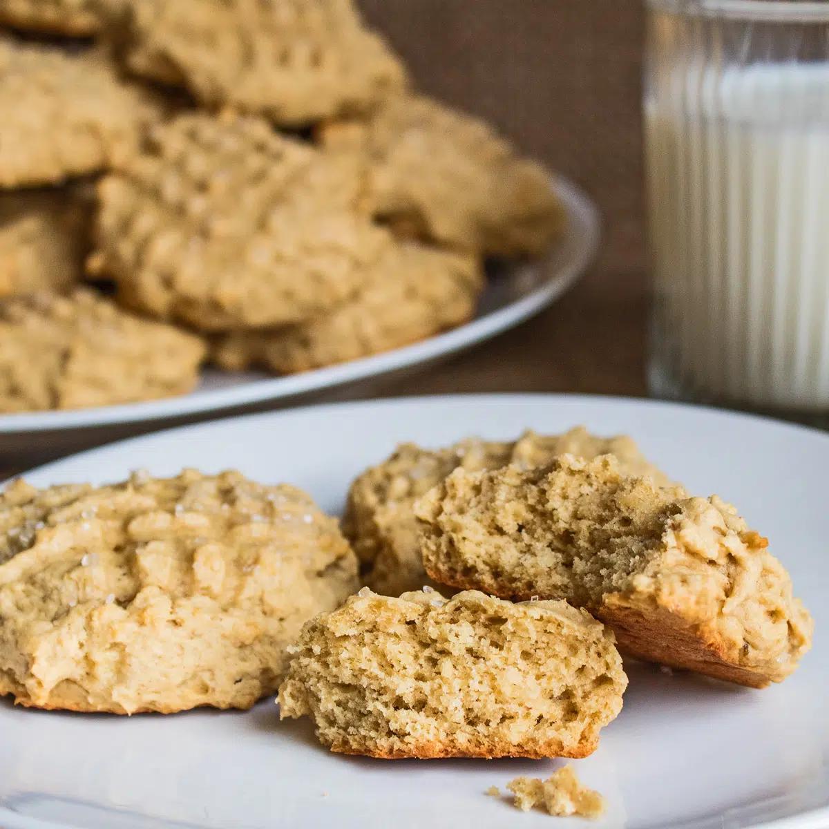 Close-up shot of a rustic-looking baking sheet with a selection of delicious homemade peanut butter and banana cookies.