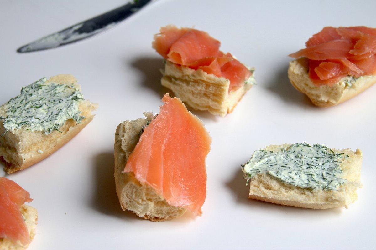 A close-up image of the finished salmon sliders, showing the texture and color of the salmon and the dill cream cheese.