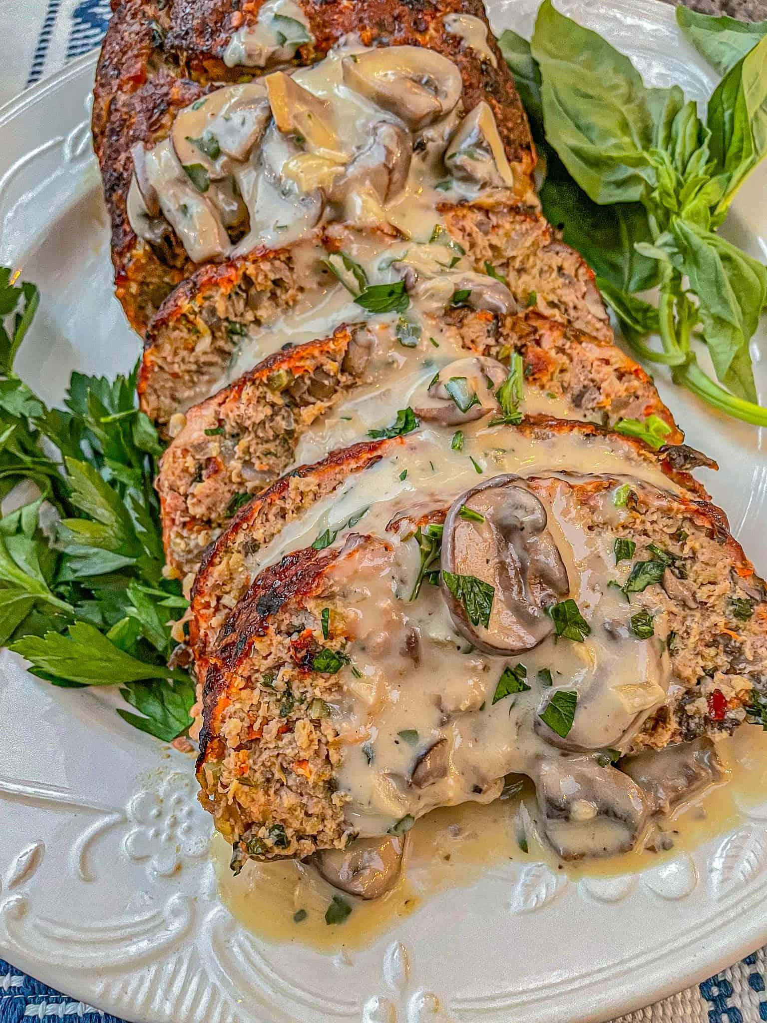 Close-up of a slice of turkey meatloaf with mushroom wine sauce