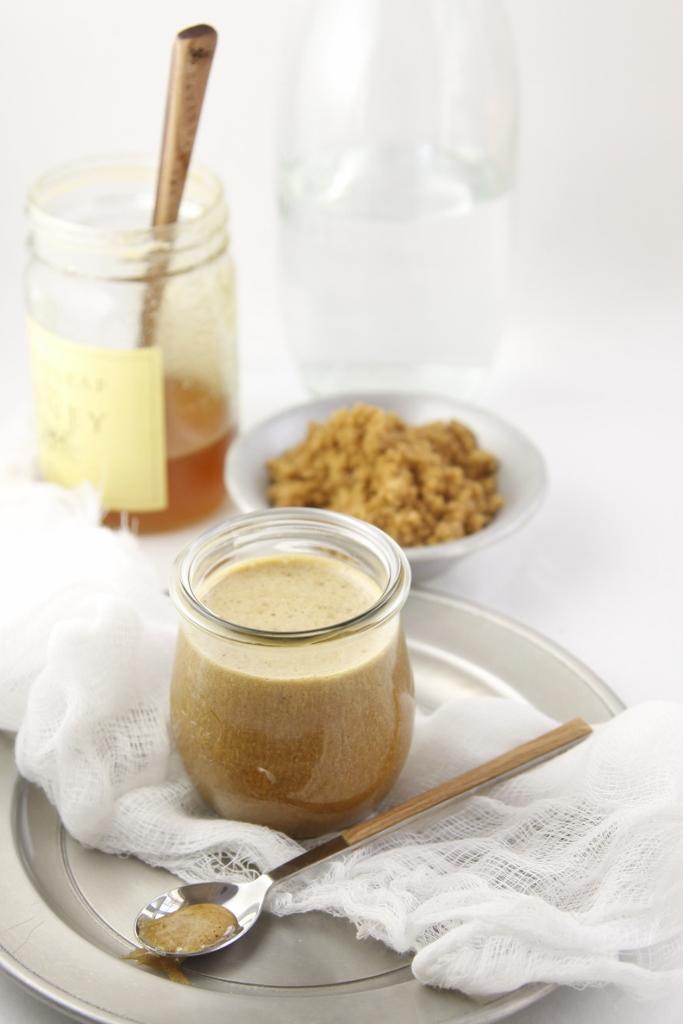 dijon mustard being whisked into a bowl with brown sugar