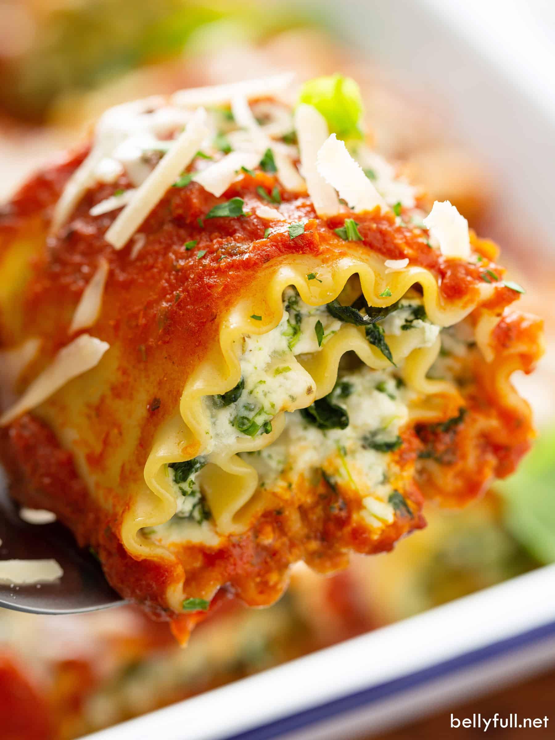 close up of lasagna roll ups being assembled