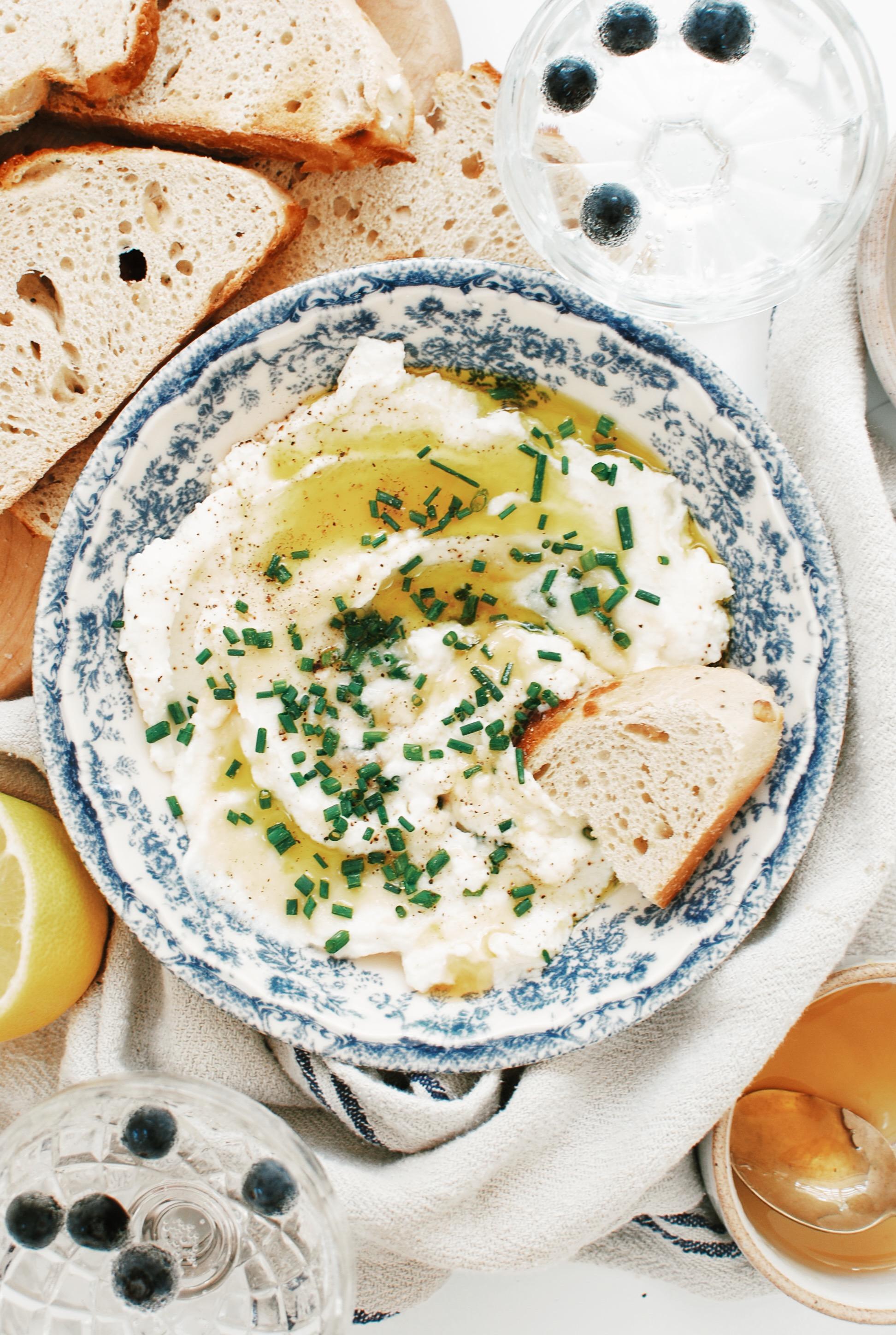 lemon ricotta in a bowl with chives
