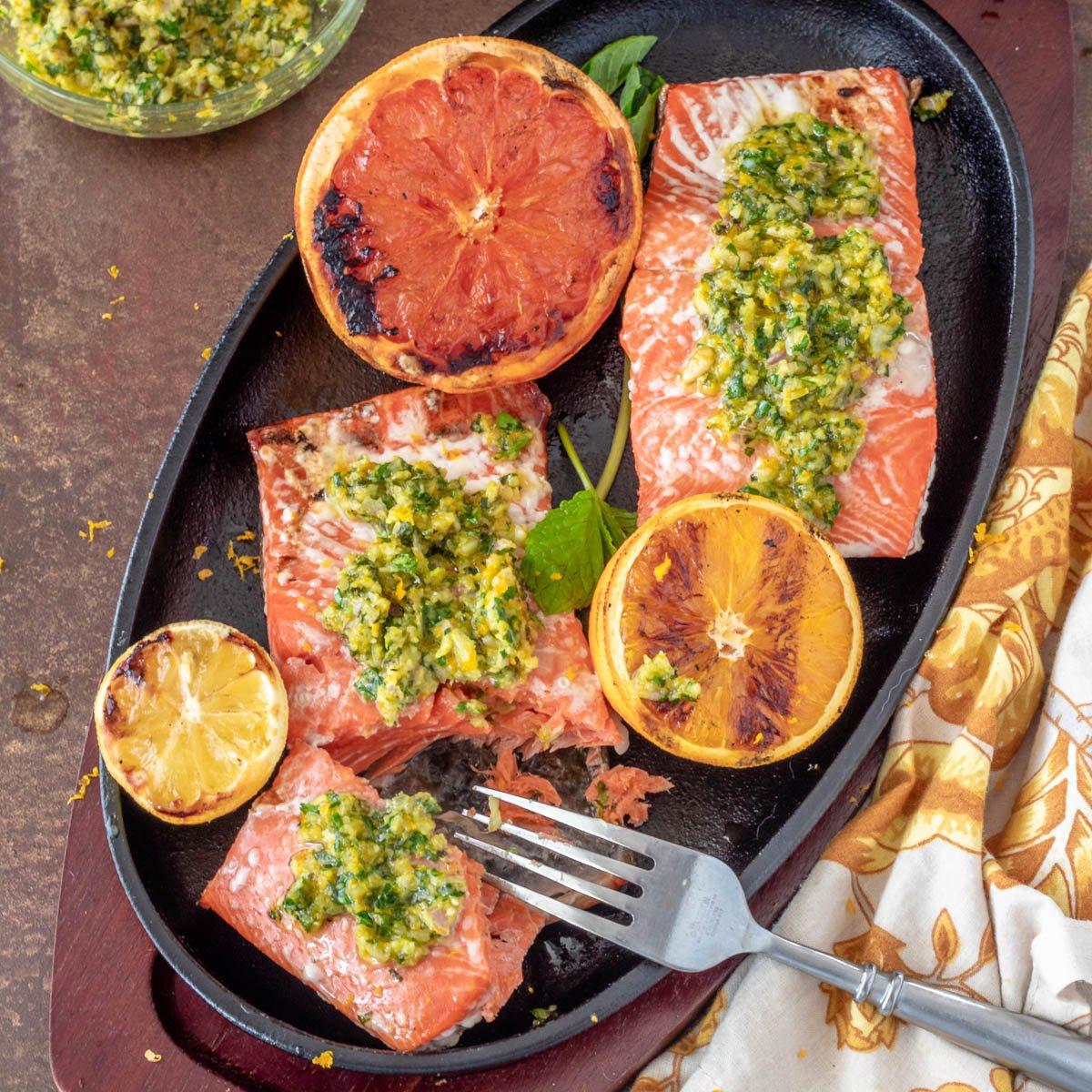Grilled fish fillets with vibrant gremolata garnish