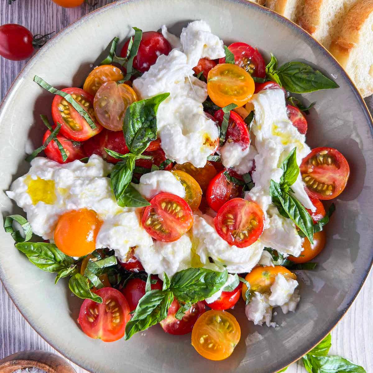 Vibrant Caprese Protein Bowl with creamy burrata, fresh basil, and juicy tomatoes
