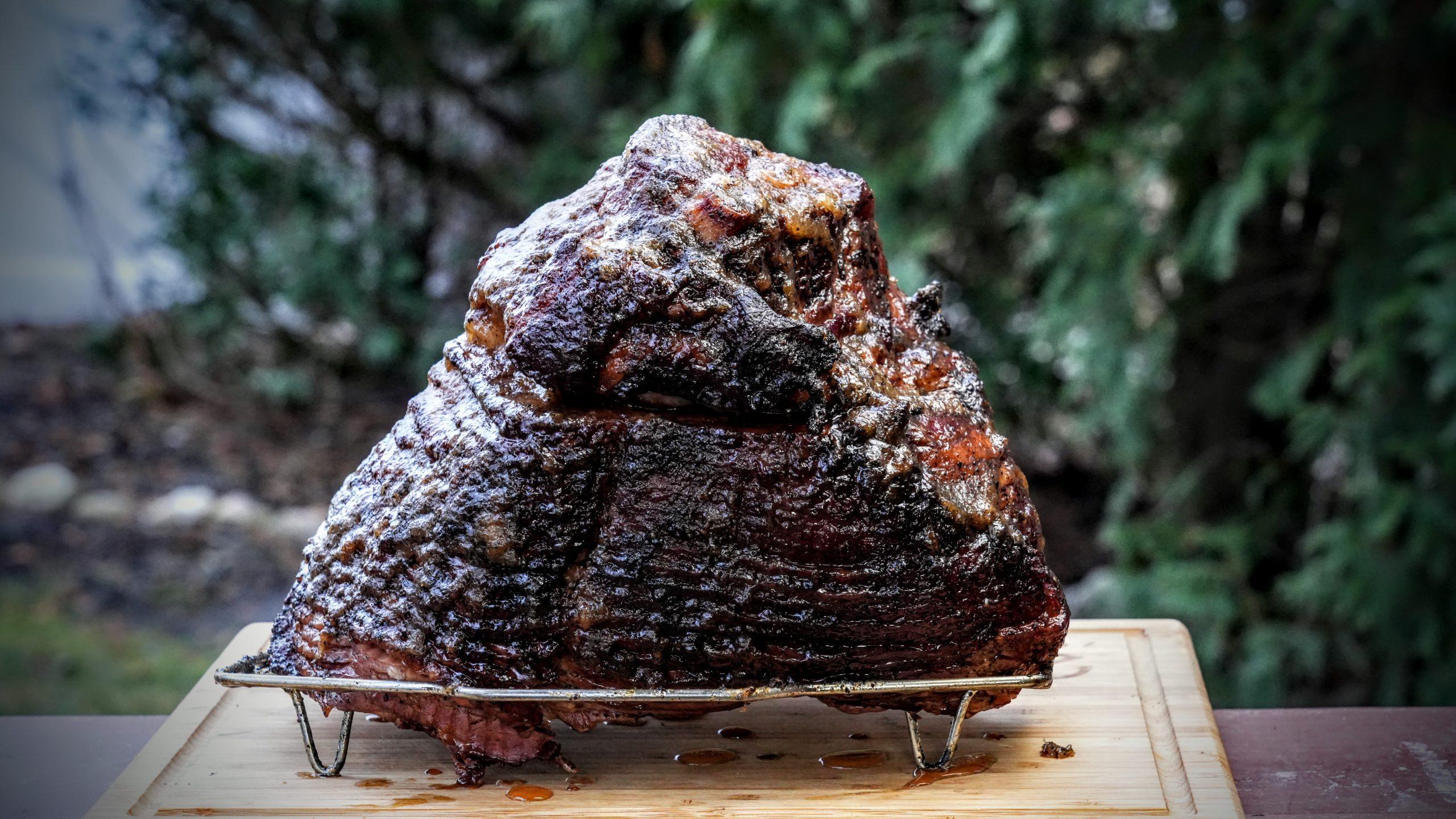 Close up of the coffee rub being applied to the ham