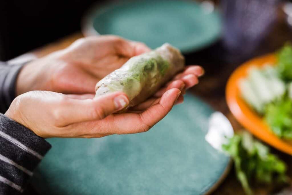 Someone preparing spring rolls