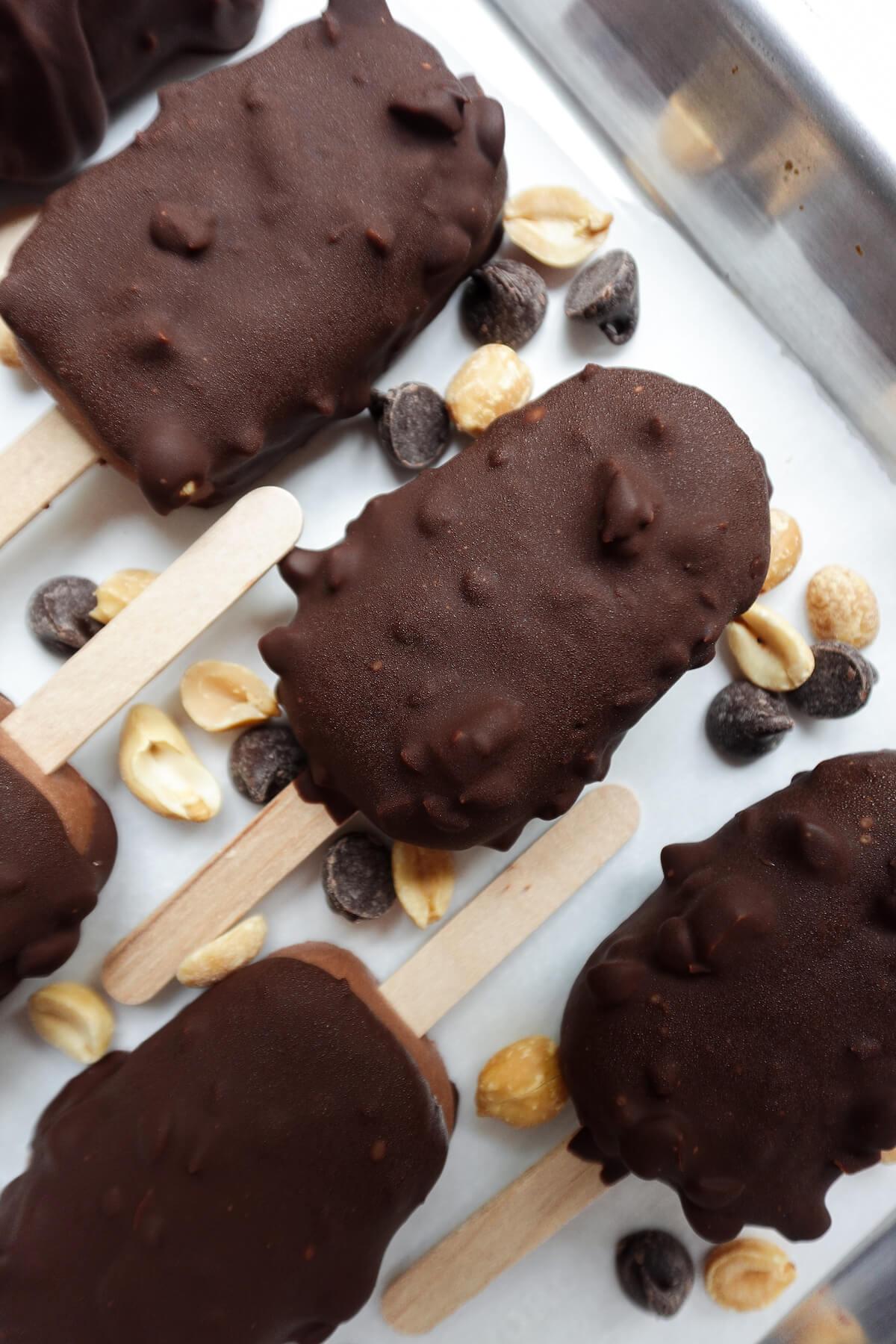 A collection of dairy-free crunch bar ice cream bars neatly arranged