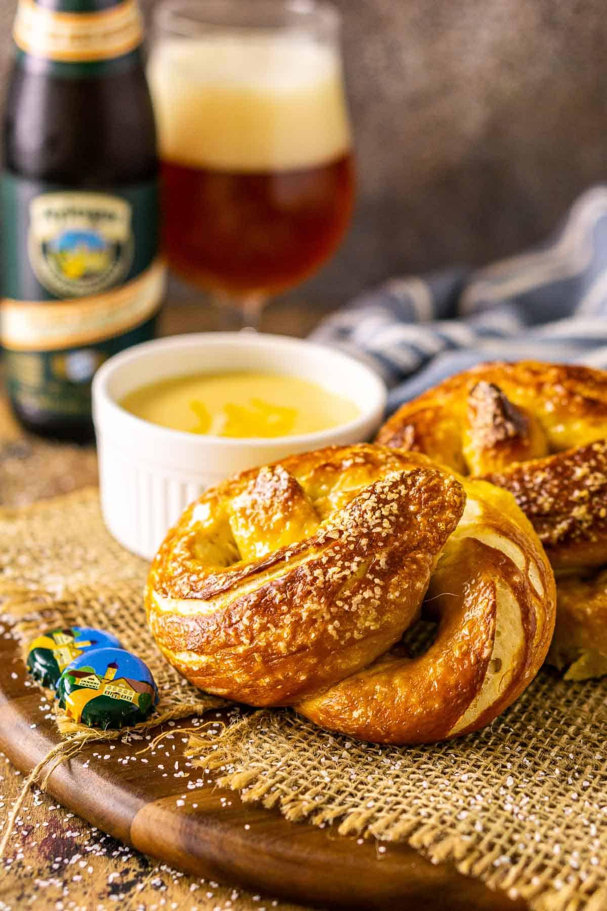 Close-up shot of crispy beer pretzels sprinkled with fresh rosemary