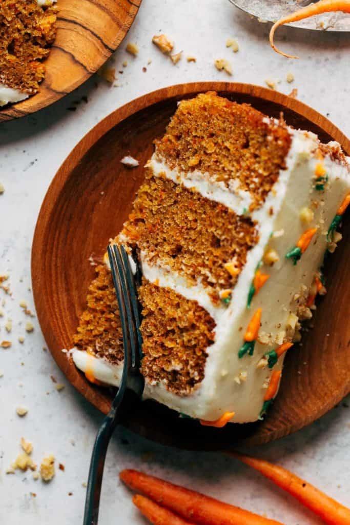 Close-up of a slice of carrot cake with cream cheese frosting