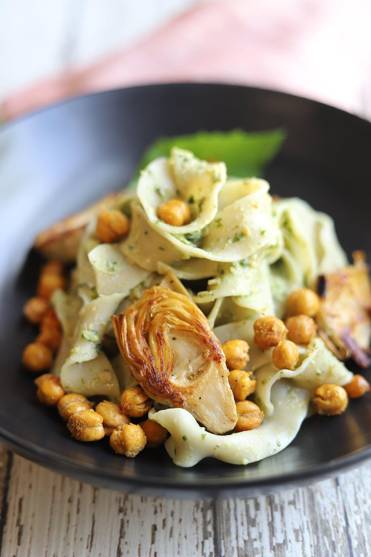 chickpea and artichoke curry with pesto garnish