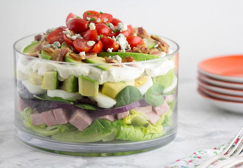 Close-up shot of the completed Seven-Layer Salad with Avocado