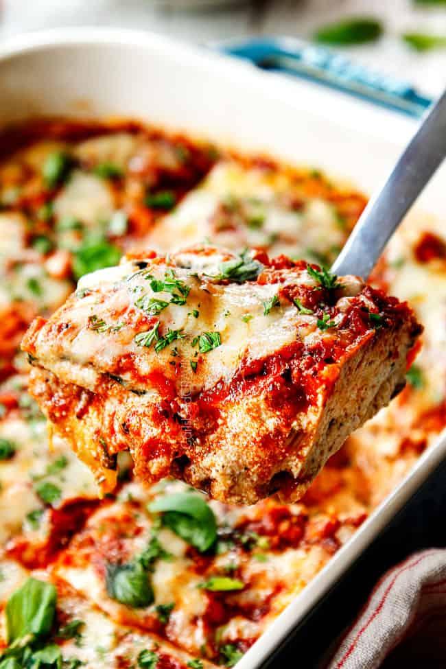 Close-up shot of a slice of zucchini lasagna, showing the layers of zucchini and creamy ricotta.