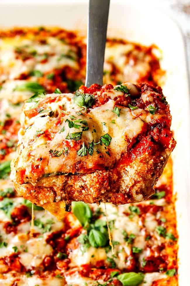 Close-up shot of a slice of zucchini lasagna, showcasing the layers and the sweet and sour sauce