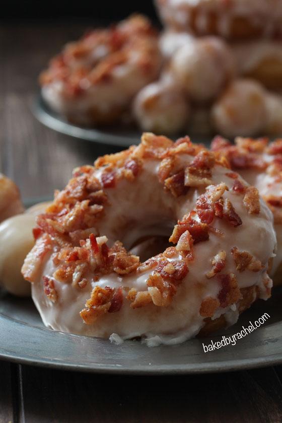 Close-up of a single maple bacon donut, showing the texture and glaze