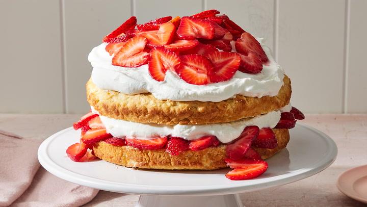 Close-up shot of strawberry shortcakes with mascarpone cream, showing juicy strawberries and fluffy biscuits