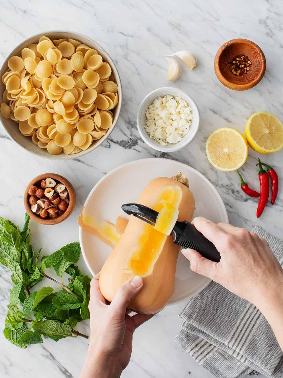 A person enjoying a bowl of butternut squash pasta