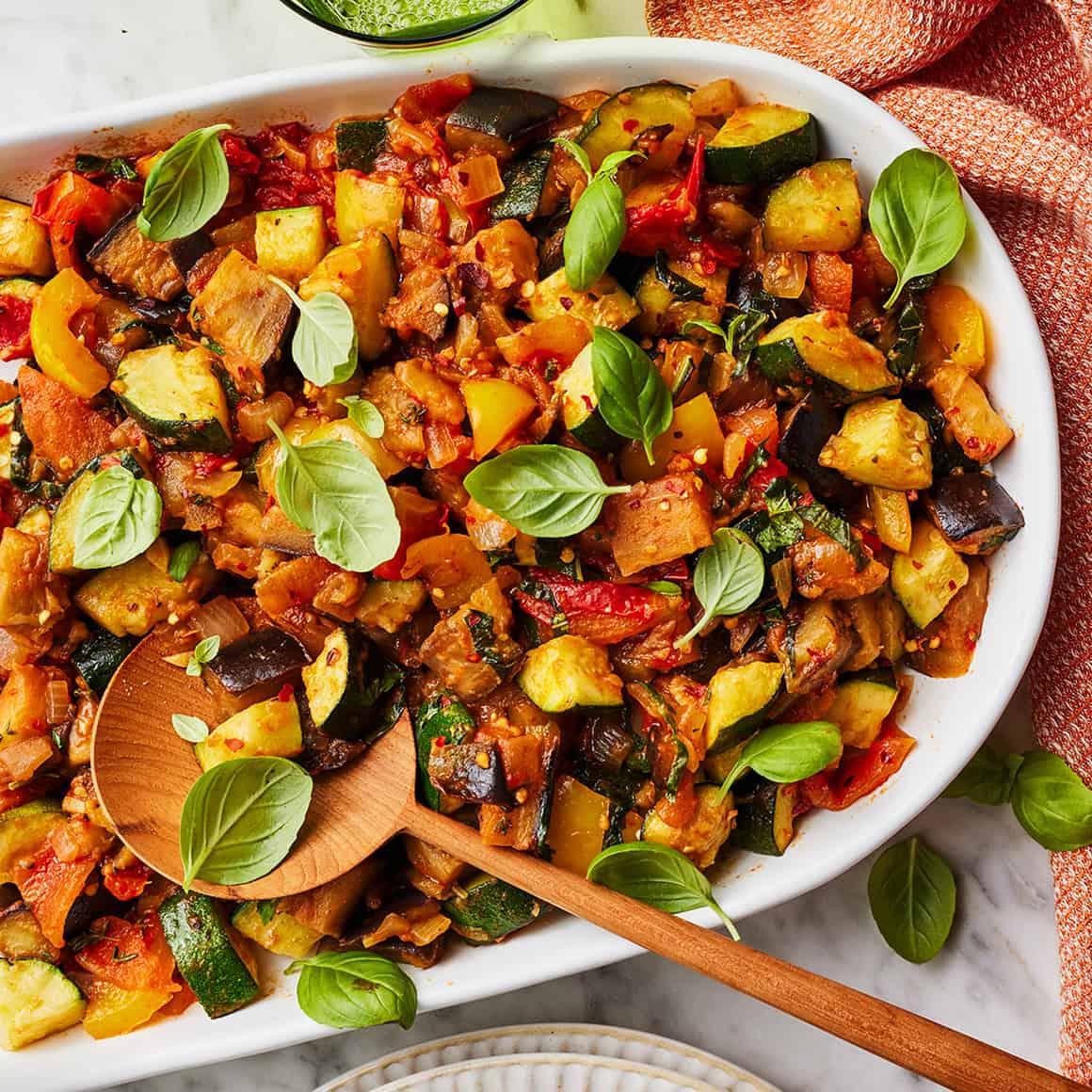 A delicious Ratatouille Roti on a plate, garnished with fresh herbs.