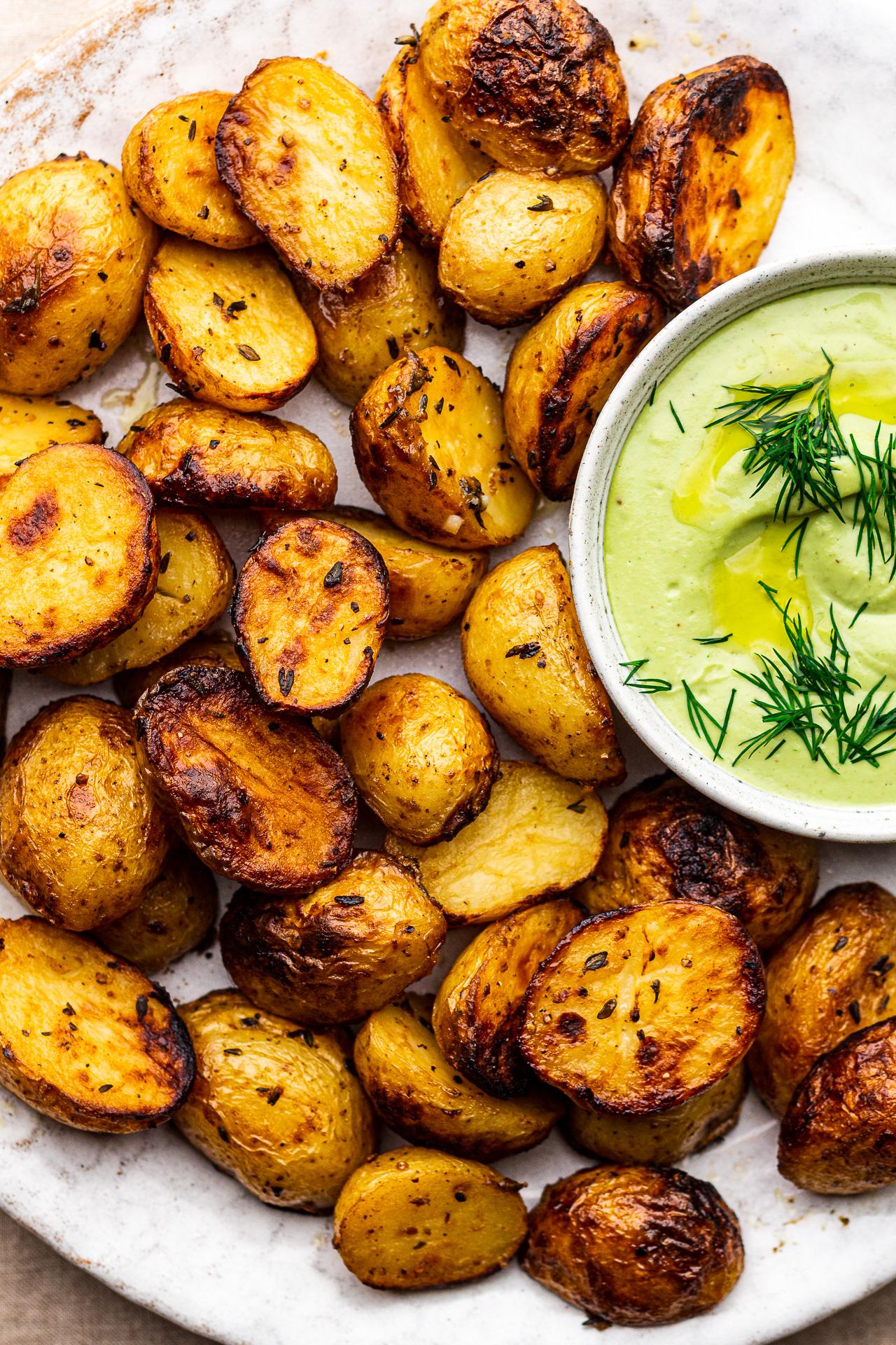 lemon and dill roasted new potatoes on a rustic plate