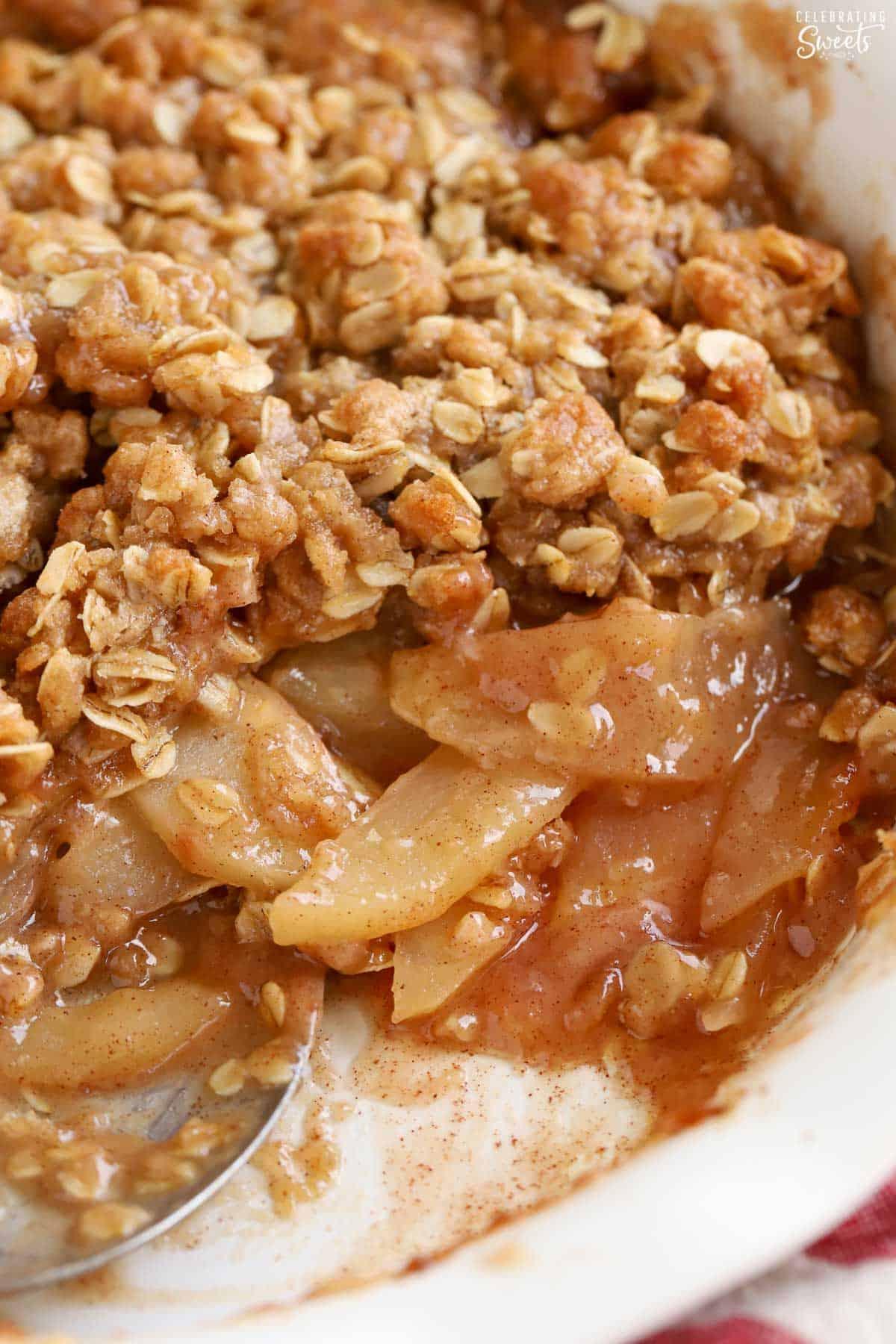 Close-up shot of a warm apple crisp with a bubbling, golden topping