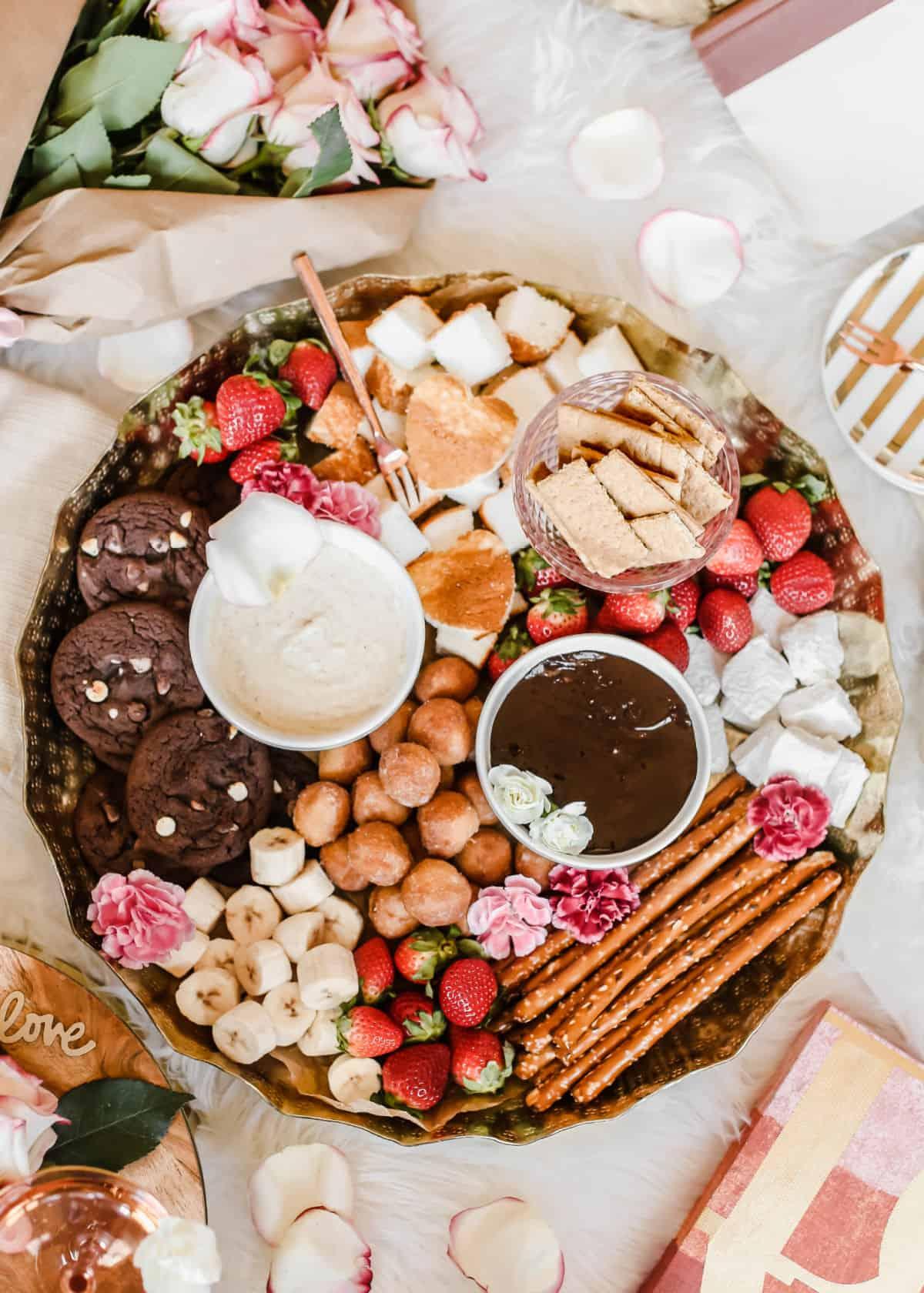 A table setting with a chocolate fondue and assorted dippers