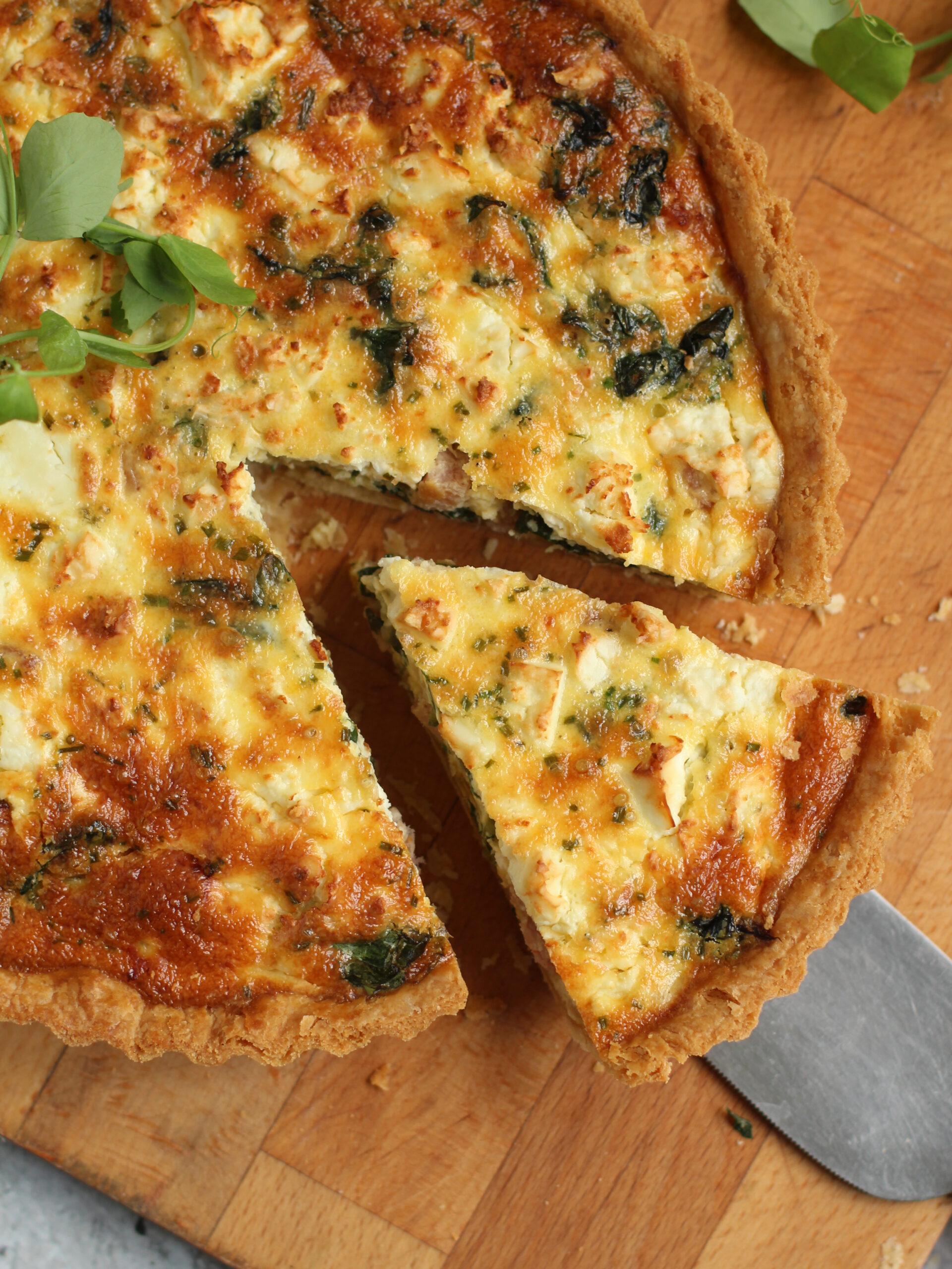 Close-up of a swiss chard and feta quiche being sliced