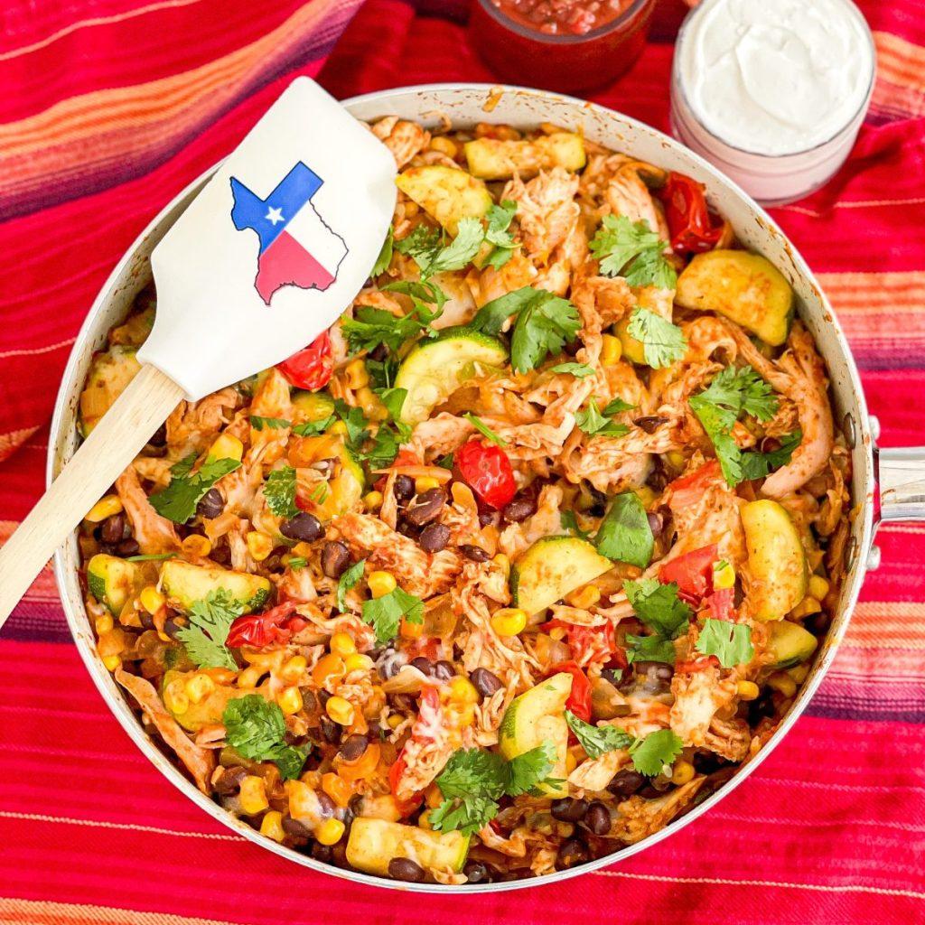 A colorful skillet filled with Garlic-Chili Sautéed Tex-Mex Vegetables, ready to be served