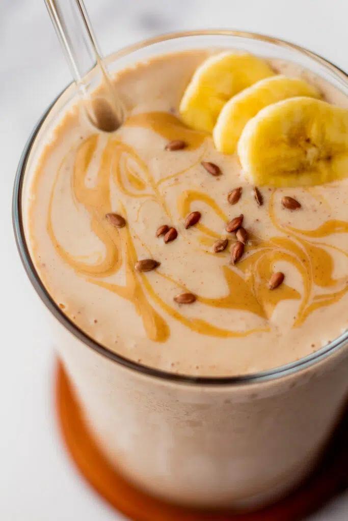 Close-up of a person enjoying a flaxseed smoothie
