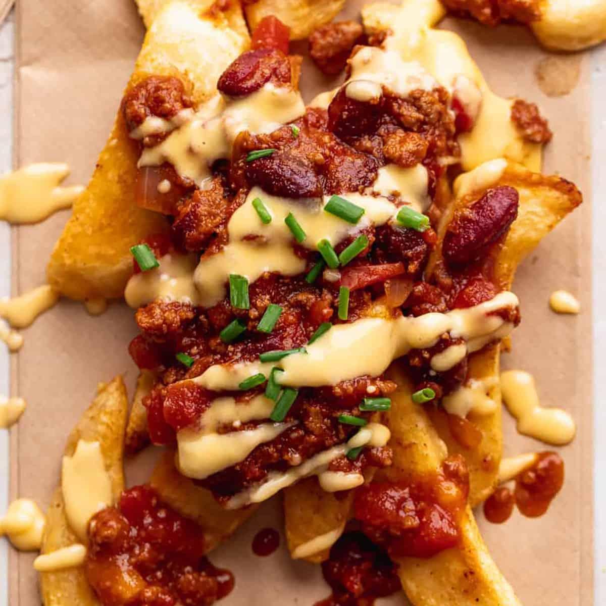 A group of friends enjoying the chili cheese fries dip