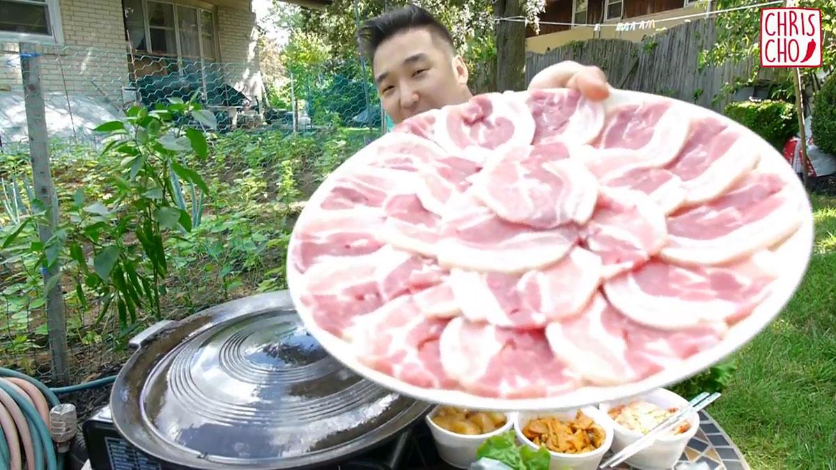 A person holding a Korean BBQ Poke Bowl