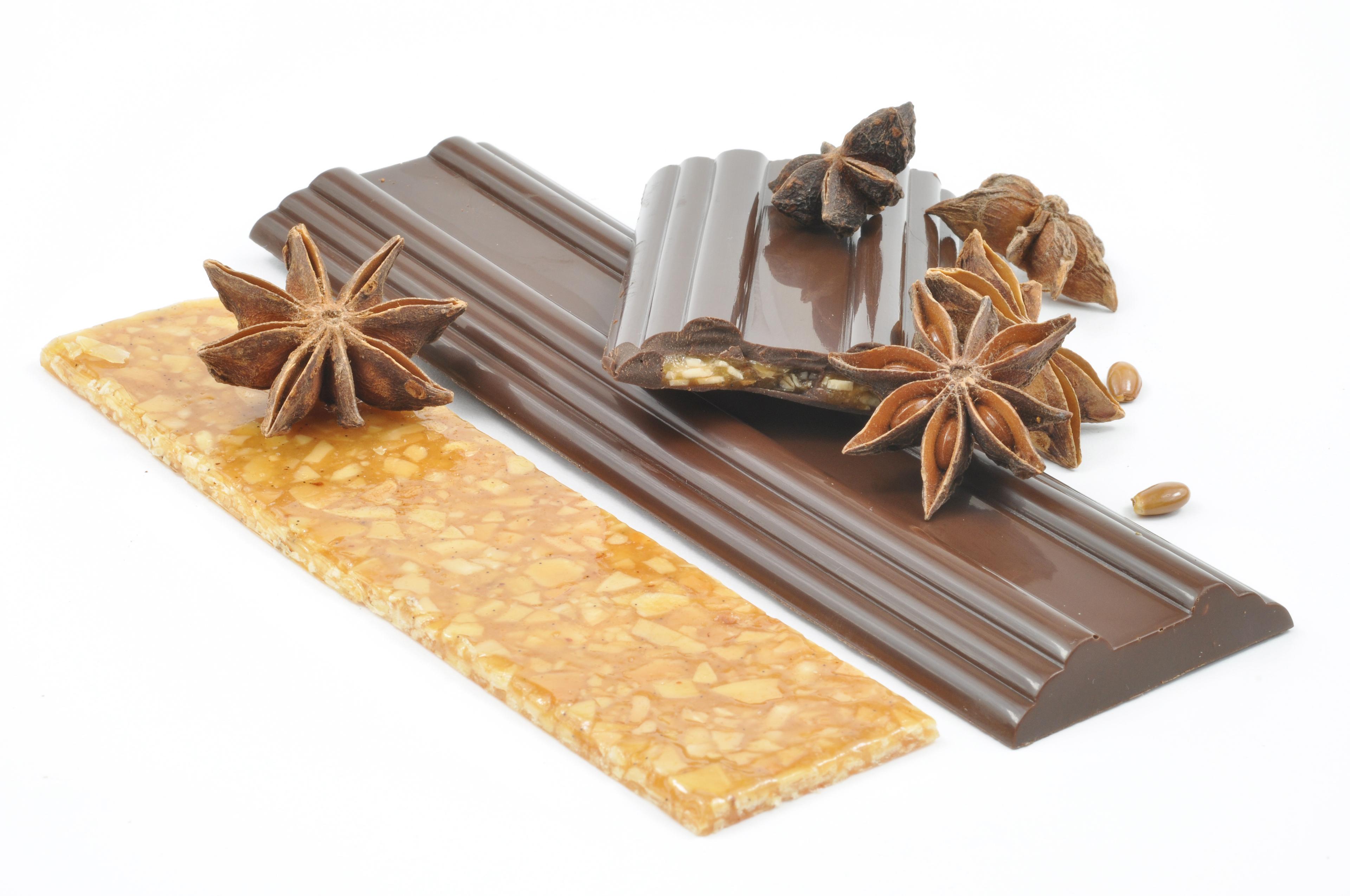 ingredients for star anise chocolates arranged on a counter