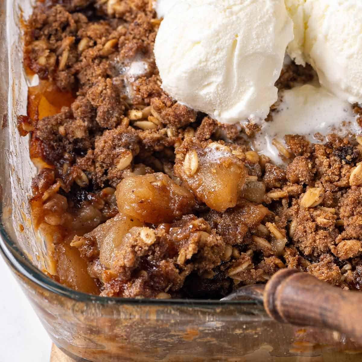 The apple crisp baking in the oven, showing the golden brown topping