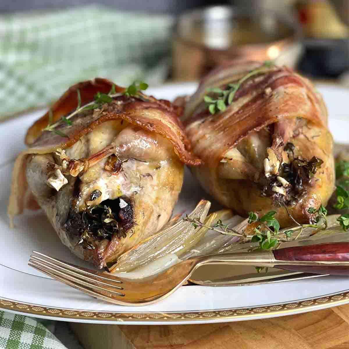 Grilled partridge on a rustic wooden platter