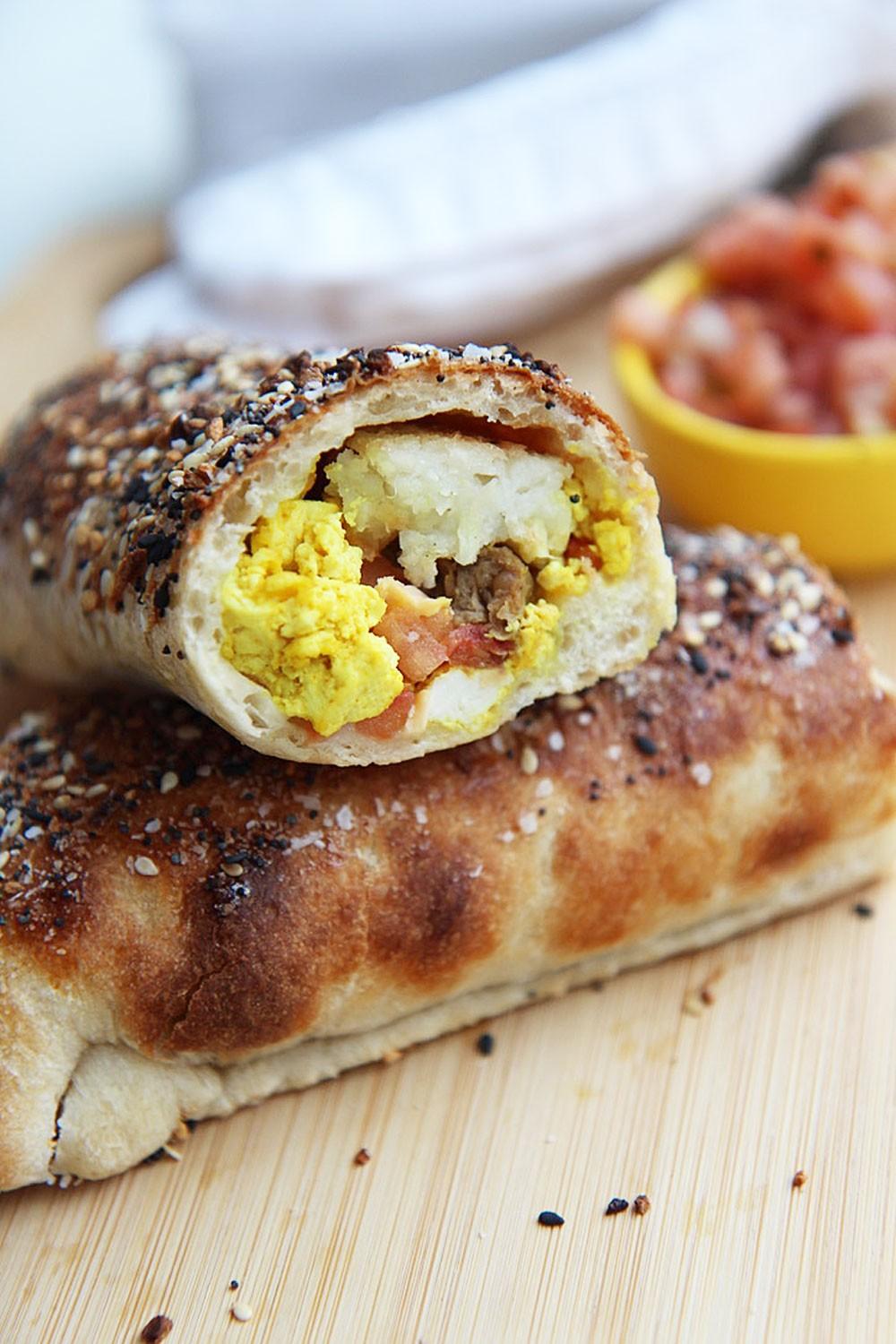 Close up shot of a bagel breakfast burrito