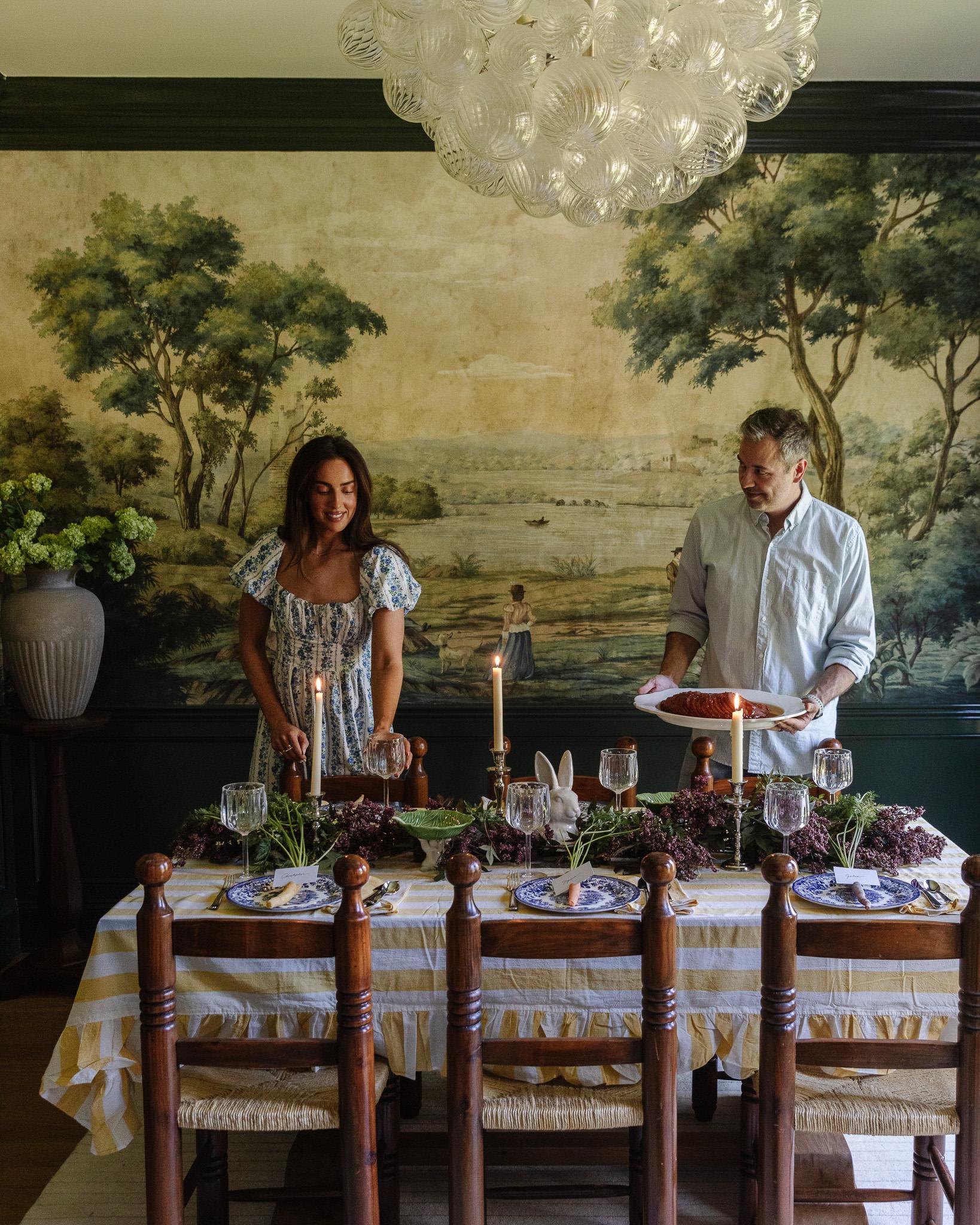 A family gathered around a table, enjoying a beautifully glazed Christmas ham