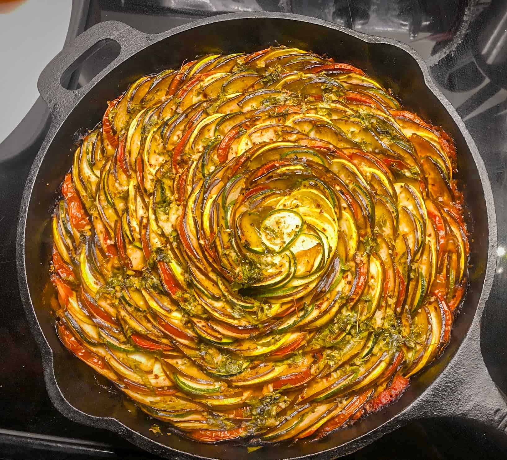Close-up shot of a Ratatouille Roti being cooked on a griddle.