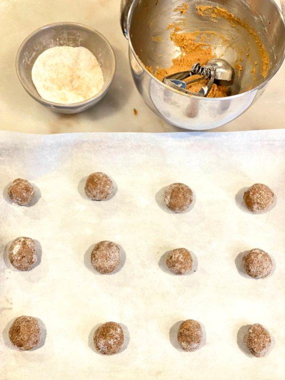 molasses cookie dough rolled in sugar, ready for baking sheet