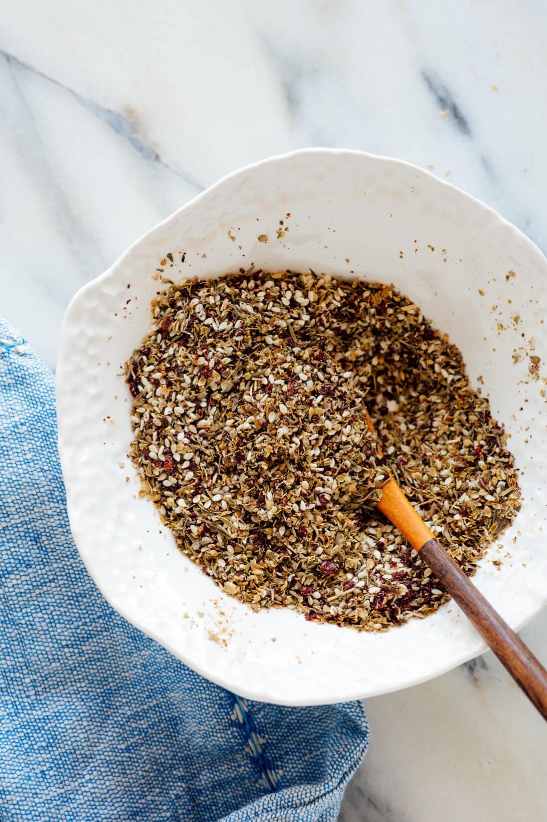Close-up of the za'atar spice blend and a bowl of Kalamata olives