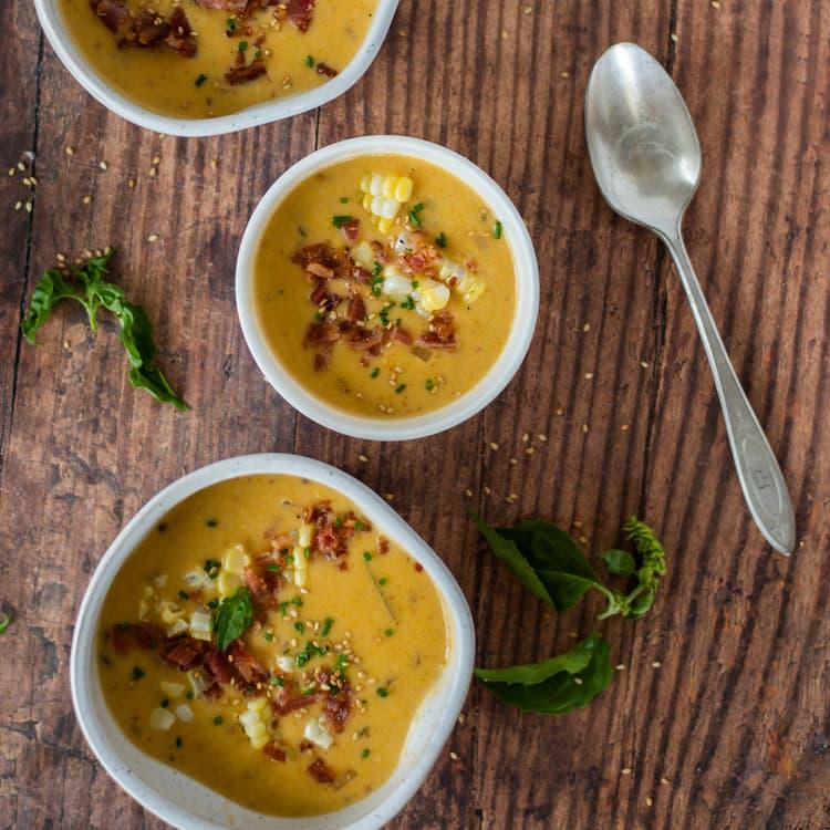 ingredients for spicy chipotle roasted potato and corn chowder arranged on a wooden table